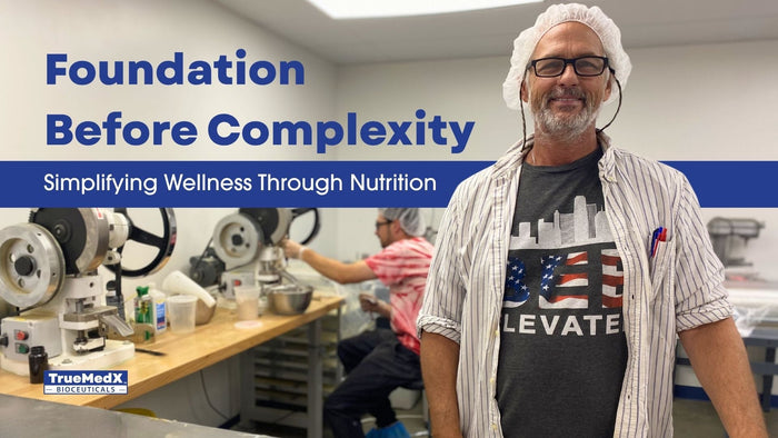 Foundational wellness education featuring Chip Paul formulating TruMedX bioceuticals in the lab to support simplified nutrition and systems-based wellness.